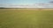 Upper view wheat fields and green meadows under sky