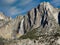 Upper Yosemite Falls against a hazy blue sky