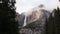 Upper Yosemite Falls With Trees And Clouds