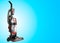 Upright Vacuum Cleaner on blue Background. House Cleaning Equipment Tool.