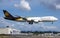 UPS Latest Boeing 747-8 Freighter Cargo airplane landing in clear blue skies