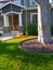 Upscale home with shaded front yard and swing