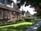 Upscale street with front yards and shaded curb