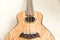 Upscale ukulele with woodgrain finish