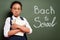 Upset african american schoolgirl with books