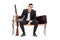 Upset businessman holding a rifle seated on a bench