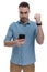 Upset casual man holding phone, frowning with fist clenched