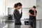 Upset couple contemplating in home kitchen