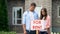 Upset couple installing for rent signboard, lack of money, social insurance