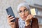 Upset and deceived woman at home received an error and wrong code, Muslim woman in hijab trying to make a purchase in an