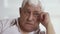 Upset depressed older elder gray-haired man crying wiping tears