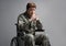 Upset disabled military man holding rosary