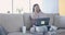 Upset female freelancer working on laptop at home