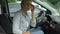 Upset female suffering from headache, sitting in automobile, migraine, health