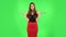 Upset girl shrugs and shakes her head negatively. Green screen
