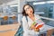 Upset girl student with workbooks and books in the classroom for lectures at the University. Concept of large learning