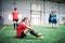 Upset girls in red sports uniform and happy young females in blue sportswear