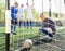 Upset goalkeeper looks at ball in goal. Football soccer tournament