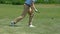Upset golf player hitting ball and missing, bad position for hit, slow-motion