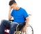 Upset handicapped man sitting on a wheelchair