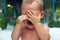 Upset little baby boy crying outdoor