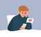 Upset male with broken heart look at screen of smartphone vector flat illustration. Frustrated guy having break up