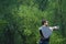 Upset man breaking acoustic guitar in the nature