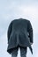 Upset Man in COat From Back Lean His Head. Headless Weird Photo