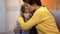 Upset mother hugging shocked daughter, feeling pain of relative loss, trouble