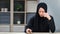 Upset Muslim woman crying read received paper letter having bad news sitting at table