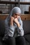 Upset muslim woman in hijab sitting