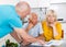 Upset old husband and wife signing agreement papers with social worker