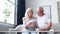 Upset pensioners receive utility bills. The elderly couple is disappointed