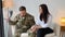 Upset Pensive Soldier Attending Meeting With Psychologist, Thoughtful Man In Military Uniform Sitting On Couch And