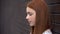 Upset red-haired young woman, frustrated female teenager, melancholy sadness