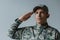 upset soldier in military uniform saluting