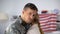 Upset US soldier embracing girlfriend looking at cam, farewell armed forces duty