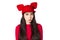 Upset white black haired young woman with mouse ears hat