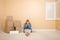 Upset Woman on Floor Next to Boxes and Blank Sign