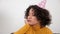 Upset woman in party hat looking away celebration holiday birthday alone at home
