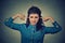 Upset woman plugging ears with fingers doesn\'t want to listen