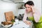 Upset woman reading bank documents