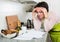 Upset woman reading bank documents