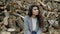 Upset woman sitting near heap of firewood, problem of deforestation