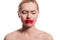 upset woman with smeared red lipstick on face looking down