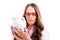 Upset woman wearing glasses holding piggy bank