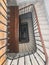 Upside view of a spiral staircase angle shot bike downstairs old french entrance