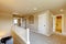 Upstairs hallway in big house with beige interior paint.