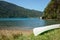 Upturned kayak on beach in picturesque Marlborough Sounds bay