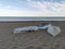 Upturned multicoloured wooden boats on a pebble beach